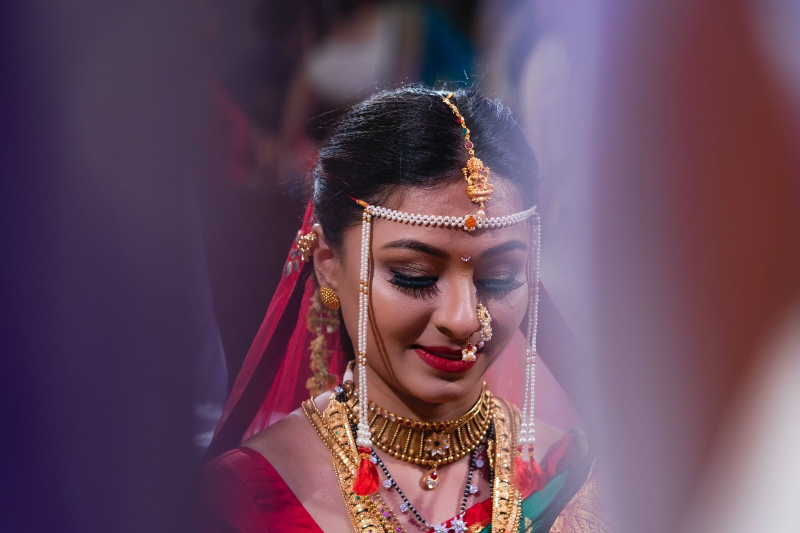 woman wearing gold-colored necklace